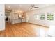 Open-concept living space with hardwood floors and seamless flow to the kitchen at 2236 The Cir, Raleigh, NC 27608