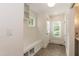 Bright mudroom with built-in bench, storage, and access to the exterior at 2236 The Cir, Raleigh, NC 27608