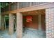 Outdoor space with brick pillars, stained wood, and decorative lighting at 2236 The Cir, Raleigh, NC 27608
