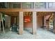 View of the outdoor finished area, with slate flooring, brick, and overhead lighting at 2236 The Cir, Raleigh, NC 27608
