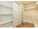 Large walk-in closet with extensive built-in shelving and storage options at 2236 The Cir, Raleigh, NC 27608