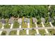 Stunning aerial view of a single-Gathering home with a well-manicured lawn and mature trees at 230 Paddy Ln, Youngsville, NC 27596