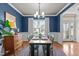 Charming dining room with hardwood floors, a large window, and stylish decor at 230 Paddy Ln, Youngsville, NC 27596