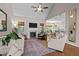 Spacious living room with high ceilings, fireplace, and open layout to the kitchen at 230 Paddy Ln, Youngsville, NC 27596