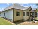 Rear exterior of home, showing siding, a screened porch, and manicured lawn at 230 Paddy Ln, Youngsville, NC 27596