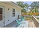 Relax on this back deck with two chairs and views of the yard at 2616 Kirk Rd, Durham, NC 27705