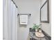 Bright bathroom features a shower, vanity with granite countertop and framed mirror at 2616 Kirk Rd, Durham, NC 27705