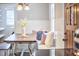 Cozy breakfast nook with built-in bench seating, decorative pillows, and a rustic wooden table at 2616 Kirk Rd, Durham, NC 27705