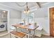 Charming breakfast nook features built-in bench seating, rustic wooden table, and wainscoting details at 2616 Kirk Rd, Durham, NC 27705