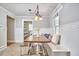 Charming breakfast nook features built-in bench seating, rustic wooden table, and wainscoting details at 2616 Kirk Rd, Durham, NC 27705