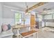 Charming dining area with built-in bench seating and a view into the kitchen at 2616 Kirk Rd, Durham, NC 27705