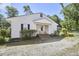 Charming house exterior featuring a gravel driveway, covered porch, and neat landscaping at 2616 Kirk Rd, Durham, NC 27705