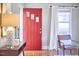 Beautiful foyer featuring a striking red door, hardwood floors, and stylish decor at 2616 Kirk Rd, Durham, NC 27705