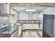 Modern kitchen with stainless steel appliances, granite counters, and stylish backsplash at 2616 Kirk Rd, Durham, NC 27705