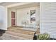 Cozy front porch with seating, providing a welcoming entrance to the home at 2616 Kirk Rd, Durham, NC 27705