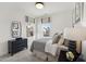 Cozy bedroom with natural light, neutral color scheme, and comfortable furnishings at 2802 Kempthorne Rd # 64, Cary, NC 27519