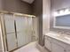 Bathroom featuring a vanity, sink, and a shower with sliding doors at 2934 Appaloosa Ct, Graham, NC 27253