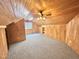 Wood paneled bedroom with a beamed ceiling and neutral carpet at 2934 Appaloosa Ct, Graham, NC 27253