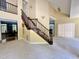 Grand foyer with staircase, high ceilings, and access to living spaces at 2934 Appaloosa Ct, Graham, NC 27253