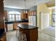 Open kitchen with island, bar seating, and modern appliances at 2934 Appaloosa Ct, Graham, NC 27253