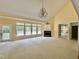 Bright living room with fireplace, chandelier, and multiple windows at 2934 Appaloosa Ct, Graham, NC 27253