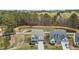 Aerial view of a home in a Gathering-friendly neighborhood with a peaceful pond and green spaces at 3020 Mavisbank Cir, Apex, NC 27502