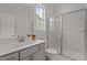 Stylish bathroom featuring a tiled shower, glass door, and modern fixtures at 3020 Mavisbank Cir, Apex, NC 27502