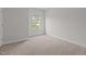 Cozy bedroom with neutral carpet and a large window at 3020 Mavisbank Cir, Apex, NC 27502