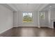 Elegant dining room featuring hardwood floors, a chandelier, and natural light, perfect for gatherings at 3020 Mavisbank Cir, Apex, NC 27502