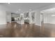 Open floor plan with modern kitchen and island, hardwood floors, stainless appliances, and recessed lighting at 3020 Mavisbank Cir, Apex, NC 27502