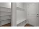 Organized mudroom with bench, cubbies, and coat hooks for storage at 3020 Mavisbank Cir, Apex, NC 27502