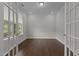 Bright office with hardwood floors, recessed lighting, and French doors, creating a professional workspace at 3020 Mavisbank Cir, Apex, NC 27502