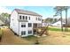 A large wooden deck and screened in porch highlight the outdoor living spaces in this rear exterior view at 3020 Mavisbank Cir, Apex, NC 27502