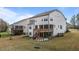 Rear exterior with deck, screened porch, and lawn, showcasing the home's outdoor living spaces at 3020 Mavisbank Cir, Apex, NC 27502