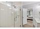 Modern bathroom with a glass shower and a view into the main bedroom at 304 Avery Glenn Way, Fuquay Varina, NC 27526