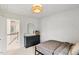 The bedroom features patterned wallpaper, dresser with mirror and stylish lighting that adds a touch of modern charm at 304 Avery Glenn Way, Fuquay Varina, NC 27526