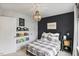 Stylish bedroom with plaid bedding, cool lighting, and playful decor at 304 Avery Glenn Way, Fuquay Varina, NC 27526
