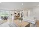 Open-concept living area with eat-in kitchen, stainless appliances, wood floors, and comfortable seating at 304 Avery Glenn Way, Fuquay Varina, NC 27526