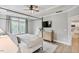 Bright main bedroom featuring a four-poster bed, dresser, and plenty of natural light at 304 Avery Glenn Way, Fuquay Varina, NC 27526