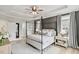 Comfortable main bedroom featuring tray ceiling, four-poster bed, and elegant decor at 304 Avery Glenn Way, Fuquay Varina, NC 27526