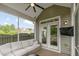 The screened porch offers a cozy spot with comfortable seating, providing a serene view of the backyard and neighborhood at 304 Avery Glenn Way, Fuquay Varina, NC 27526