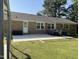 Nice backyard featuring brick house, patio furniture, and concrete patio at 305 Briarcliff Dr, Dunn, NC 28334