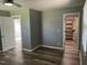 Bedroom featuring wood-look floors and open doorways to other rooms at 305 Briarcliff Dr, Dunn, NC 28334