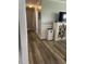 Hallway featuring hardwood floors, decorative trim, and access to multiple rooms at 305 Briarcliff Dr, Dunn, NC 28334