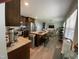 Open kitchen with large island, stainless steel appliances, and adjacent dining and living areas at 305 Briarcliff Dr, Dunn, NC 28334