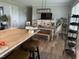 Open kitchen with large island and adjacent dining area with decorative lighting at 305 Briarcliff Dr, Dunn, NC 28334