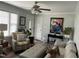 Comfortable living room featuring a ceiling fan, plush seating, and stylish decor at 305 Briarcliff Dr, Dunn, NC 28334