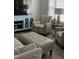 Bright living room with accent chairs, modern furniture, and natural light at 305 Briarcliff Dr, Dunn, NC 28334