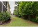Well-maintained backyard with lush green lawn, providing ample space for recreation and gardening at 317 Springhurst Ln, Cary, NC 27511