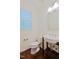 Bright half bathroom with elegant vessel sink, chrome fixtures, and a window at 317 Springhurst Ln, Cary, NC 27511